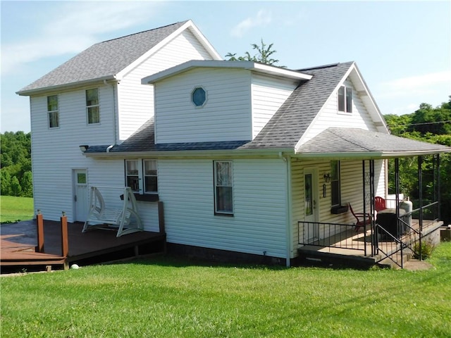 577 Woodside Old Frame Rd, Smithfield, PA 15478 - back of house featuring a lawn, a shingled roof, covered porch, and a wooden deck