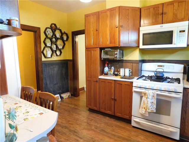577 Woodside Old Frame Rd, Smithfield, PA 15478 - kitchen featuring white appliances, brown cabinets, wood finished floors, and light countertops