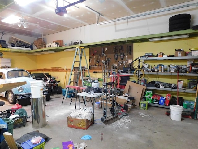 577 Woodside Old Frame Rd, Smithfield, PA 15478 - garage featuring a garage door opener and a workshop area