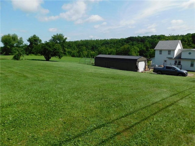 577 Woodside Old Frame Rd, Smithfield, PA 15478 - view of grassy yard featuring an outdoor structure and a detached garage