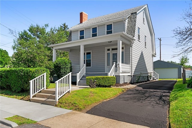 616 W College St, Canonsburg, PA 15317 - view of front of house with a porch, a chimney, an outdoor structure, and a detached garage