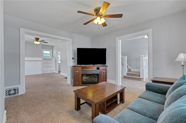 616 W College St, Canonsburg, PA 15317 - living area featuring ceiling fan, carpet floors, and stairway