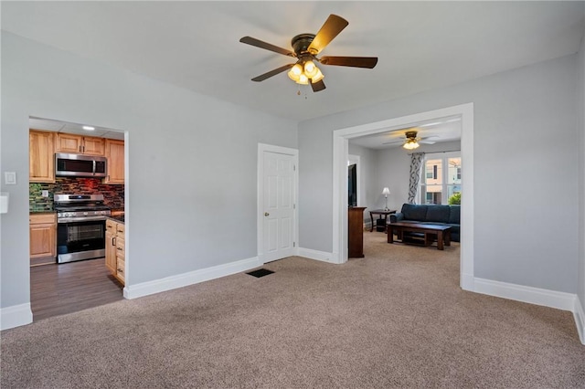 616 W College St, Canonsburg, PA 15317 - living area with dark carpet and a ceiling fan