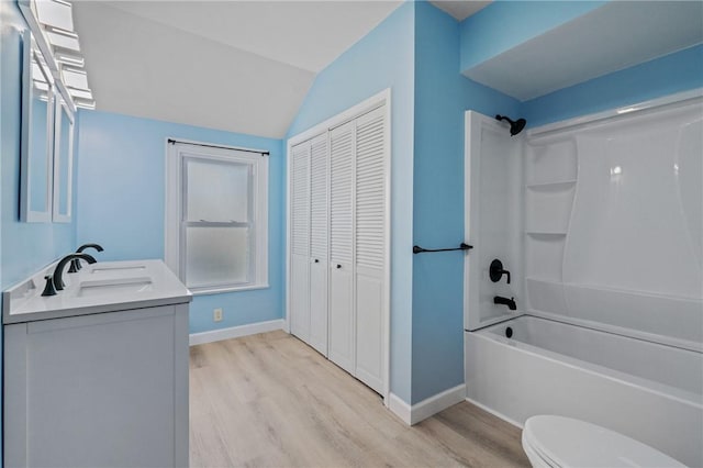 616 W College St, Canonsburg, PA 15317 - bathroom with wood finished floors, a closet, vanity, shower / bath combination, and lofted ceiling