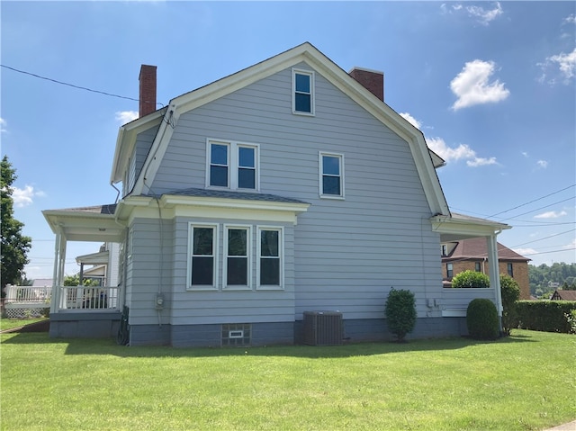 616 W College St, Canonsburg, PA 15317 - view of property exterior with a chimney, a gambrel roof, and a lawn