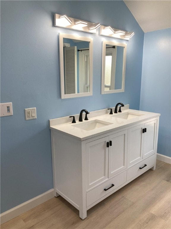 616 W College St, Canonsburg, PA 15317 - full bath with wood finished floors and double vanity