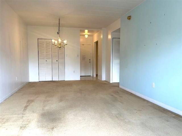 5715 Beacon St Unit 511, Squirrel Hill, PA 15217 - unfurnished dining area featuring a chandelier and carpet flooring
