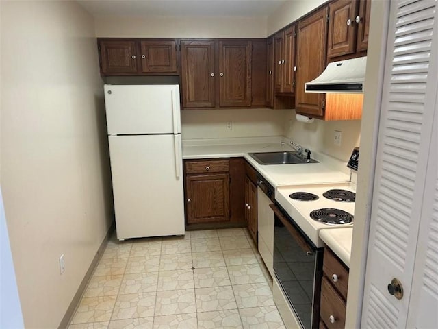 5715 Beacon St Unit 511, Squirrel Hill, PA 15217 - kitchen with white appliances, under cabinet range hood, light countertops, and dark brown cabinets