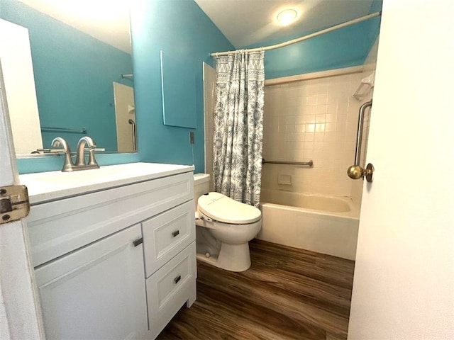 5715 Beacon St Unit 511, Squirrel Hill, PA 15217 - bathroom with wood finished floors, shower / bath combo with shower curtain, vanity, and vaulted ceiling