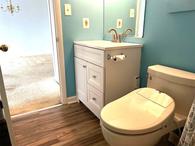 5715 Beacon St Unit 511, Squirrel Hill, PA 15217 - bathroom featuring vanity, wood finished floors, and a chandelier