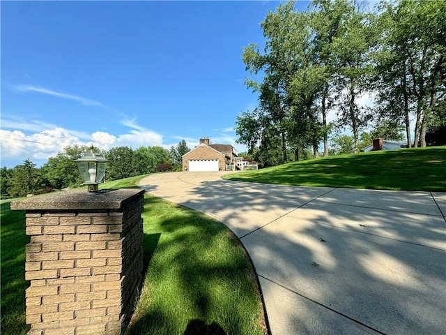 585 Taylor Dr, North Strabane, PA 15317 - view of green lawn featuring a garage and driveway
