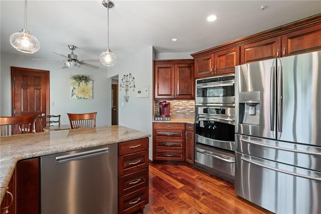 585 Taylor Dr, North Strabane, PA 15317 - kitchen featuring appliances with stainless steel finishes, a warming drawer, dark wood-type flooring, backsplash, and a ceiling fan