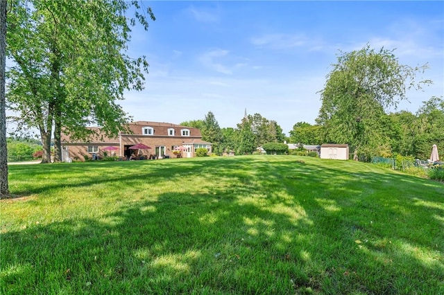 585 Taylor Dr, North Strabane, PA 15317 - view of grassy yard featuring a shed