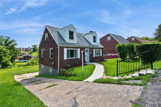 4057 Eliza St, West Mifflin, PA 15122 - view of front facade with brick siding and a front yard