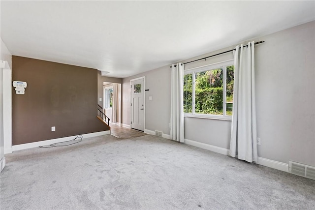 4057 Eliza St, West Mifflin, PA 15122 - unfurnished living room with carpet flooring and baseboards