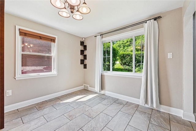 4057 Eliza St, West Mifflin, PA 15122 - unfurnished room featuring a chandelier and baseboards