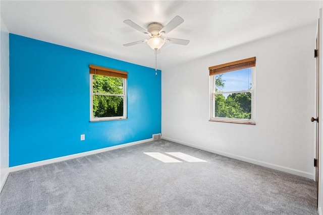 4057 Eliza St, West Mifflin, PA 15122 - carpeted empty room with a ceiling fan and baseboards