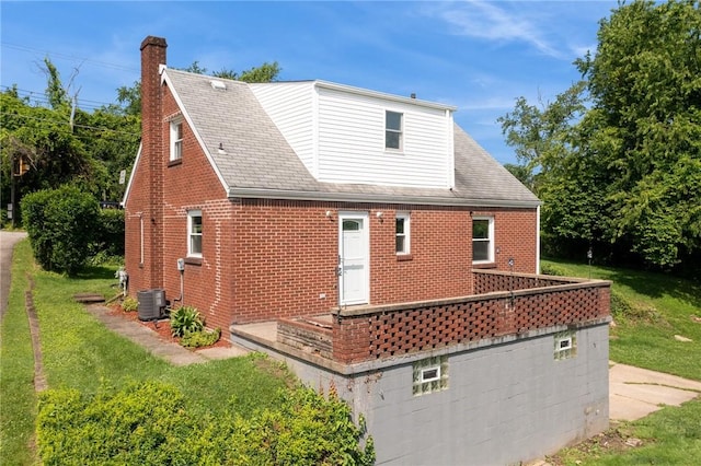 4057 Eliza St, West Mifflin, PA 15122 - rear view of property featuring brick siding, a chimney, a yard, and roof with shingles