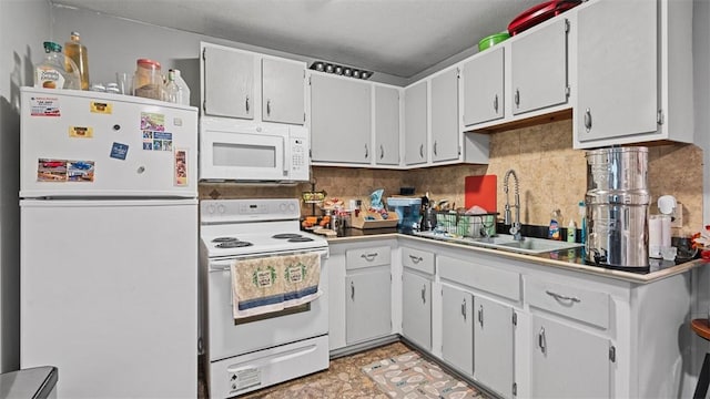 117 Carroll St, Aliquippa, PA 15001 - kitchen featuring white appliances, tasteful backsplash, and white cabinetry