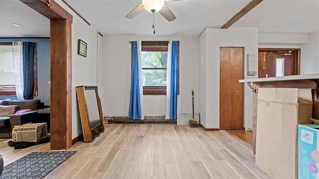117 Carroll St, Aliquippa, PA 15001 - unfurnished living room with wood finished floors and a ceiling fan