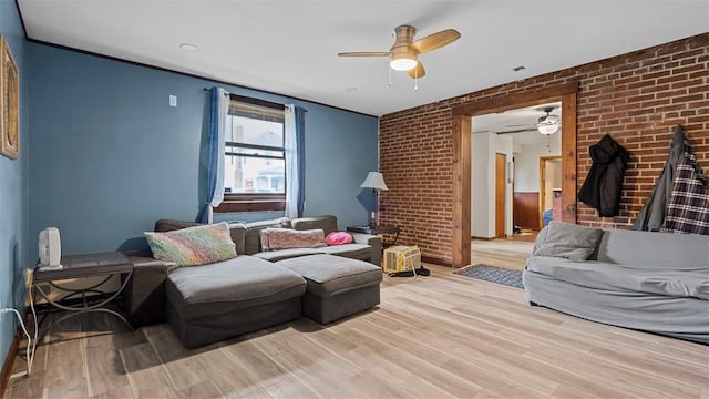 117 Carroll St, Aliquippa, PA 15001 - living area with ceiling fan, brick wall, and light wood-style floors