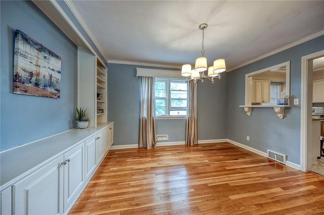 6833 Meade St Unit 17, Point Breeze, PA 15208 - unfurnished dining area featuring a chandelier, light wood-style flooring, and ornamental molding