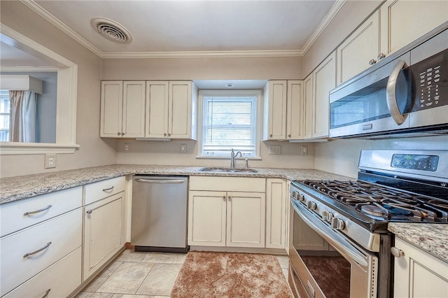 6833 Meade St Unit 17, Point Breeze, PA 15208 - kitchen featuring stainless steel appliances, ornamental molding, and light stone counters