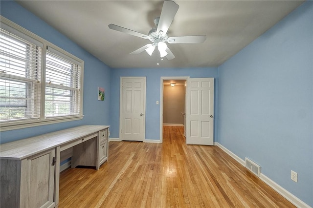 6833 Meade St Unit 17, Point Breeze, PA 15208 - unfurnished bedroom with light wood-type flooring, a desk, and ceiling fan