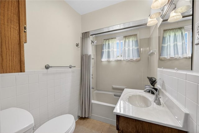 17 Fremont Rd, Pa, PA 15022 - bathroom featuring tile walls, vanity, shower / bath combo with shower curtain, tile patterned floors, and a wainscoted wall