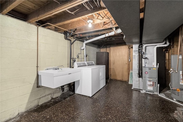 17 Fremont Rd, Pa, PA 15022 - unfinished basement featuring washer and clothes dryer, heating unit, and water heater
