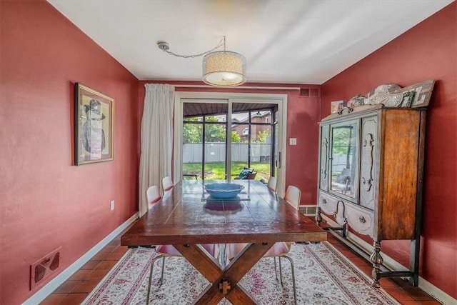 1230 Northwestern Dr, Monroeville, PA 15146 - dining area with dark tile patterned flooring and baseboards