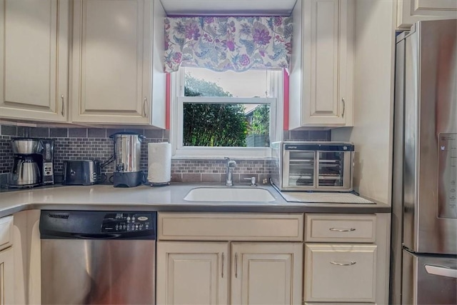 1230 Northwestern Dr, Monroeville, PA 15146 - kitchen featuring appliances with stainless steel finishes, decorative backsplash, and light countertops