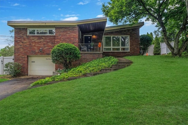 1230 Northwestern Dr, Monroeville, PA 15146 - view of front of house featuring an attached garage, driveway, and brick siding