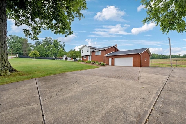 207 State Park Rd, New Alexandria, PA 15670 - view of property exterior with brick siding, a yard, and driveway