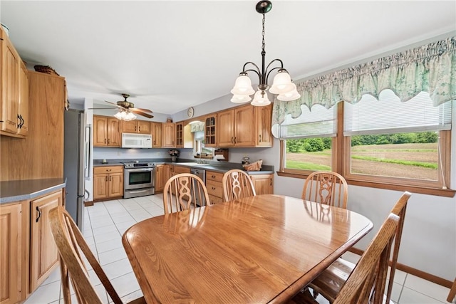 207 State Park Rd, New Alexandria, PA 15670 - dining area featuring light tile patterned flooring, ceiling fan, and a chandelier