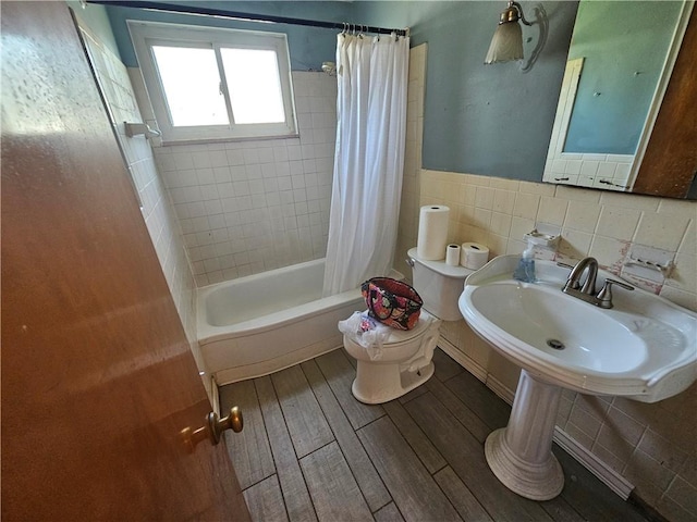4235 Willow Ave, Castle Shannon, PA 15234 - bathroom featuring wood finished floors, shower / tub combo with curtain, and tile walls