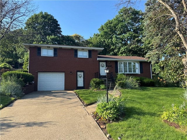 1306 Spring St, Derry Twp, PA 15650 - tri-level home with a garage, brick siding, concrete driveway, and a front lawn