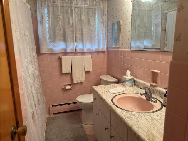 1306 Spring St, Derry Twp, PA 15650 - full bathroom with a baseboard radiator, vanity, tile walls, wallpapered walls, and wainscoting