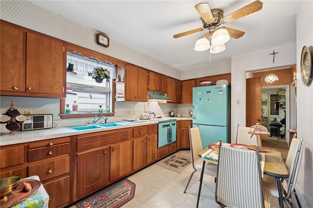 340 Weldon St, Latrobe, PA 15650 - kitchen with freestanding refrigerator, under cabinet range hood, stainless steel dishwasher, and light countertops