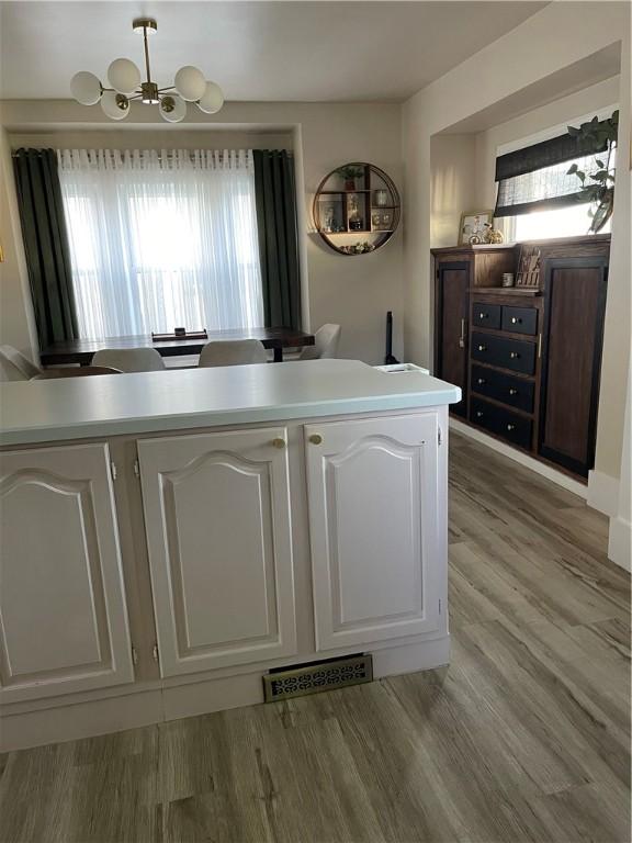 1022 Dewey Ave, New Castle/3Rd, PA 16101 - detailed view of a chandelier and wood finished floors