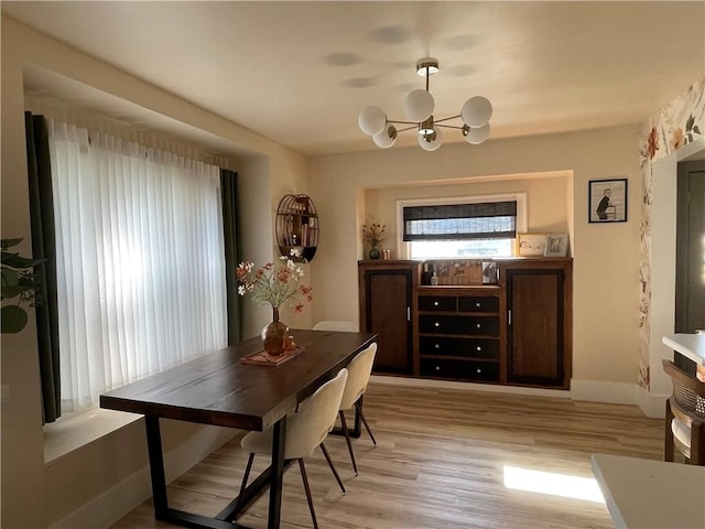 1022 Dewey Ave, New Castle/3Rd, PA 16101 - dining space featuring a chandelier and light wood-style flooring