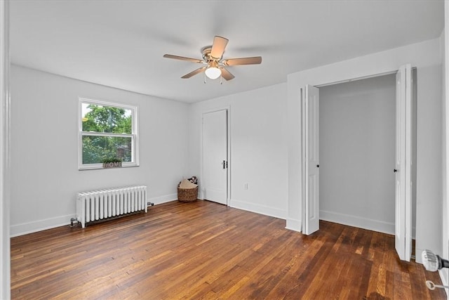 7032 Reynolds St, Point Breeze, PA 15208 - bedroom featuring radiator heating unit, wood finished floors, ceiling fan, and two closets