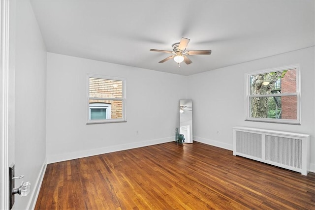 7032 Reynolds St, Point Breeze, PA 15208 - unfurnished room featuring radiator heating unit, a ceiling fan, and wood finished floors