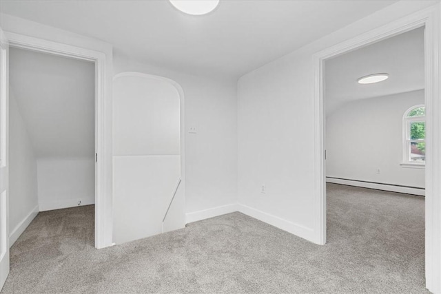 7032 Reynolds St, Point Breeze, PA 15208 - empty room with a baseboard radiator and carpet floors