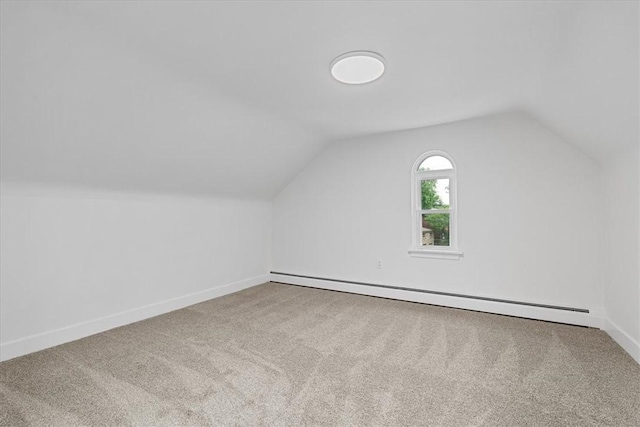 7032 Reynolds St, Point Breeze, PA 15208 - bonus room with baseboard heating, carpet, and vaulted ceiling