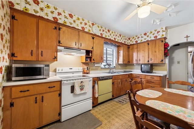 340 Weldon St, Latrobe, PA 15650 - kitchen featuring white electric range, dishwasher, stainless steel microwave, under cabinet range hood, and light countertops