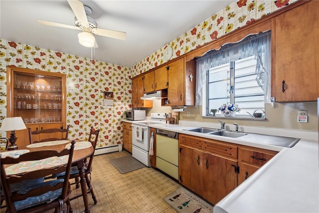 340 Weldon St, Latrobe, PA 15650 - kitchen with wallpapered walls, dishwasher, electric stove, under cabinet range hood, and a baseboard heating unit