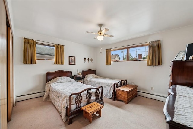 340 Weldon St, Latrobe, PA 15650 - bedroom featuring a baseboard heating unit, light carpet, a ceiling fan, and a closet