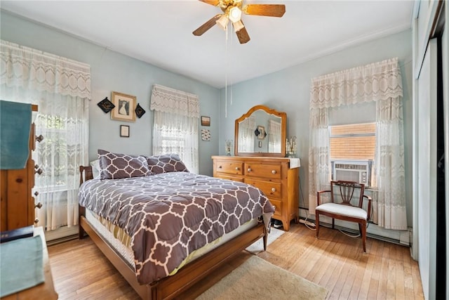 340 Weldon St, Latrobe, PA 15650 - bedroom featuring multiple windows, wood-type flooring, cooling unit, and a ceiling fan