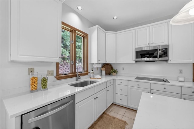 408 Bryn Ct, Ross Twp, PA 15237 - kitchen featuring appliances with stainless steel finishes, white cabinetry, light countertops, light tile patterned floors, and recessed lighting
